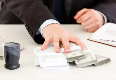 closeup-business-mans-hand-giving-260nw-70585102_1
