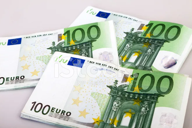 20984194-bundles-of-100-euro-bank-notes